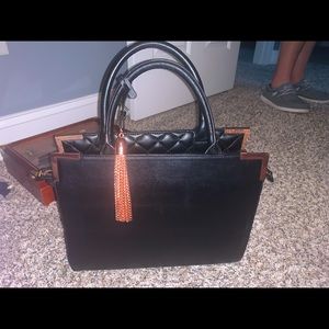 Black and rose gold purse